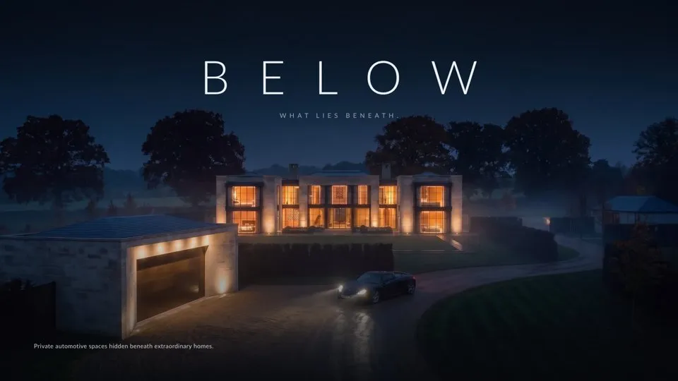 The cover of the BELOW brochure: a limestone country house at dusk with a black sports car arriving through the mist